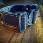 Angled view of black leather COBRA collar with contrasting stitching and quick-release buckle