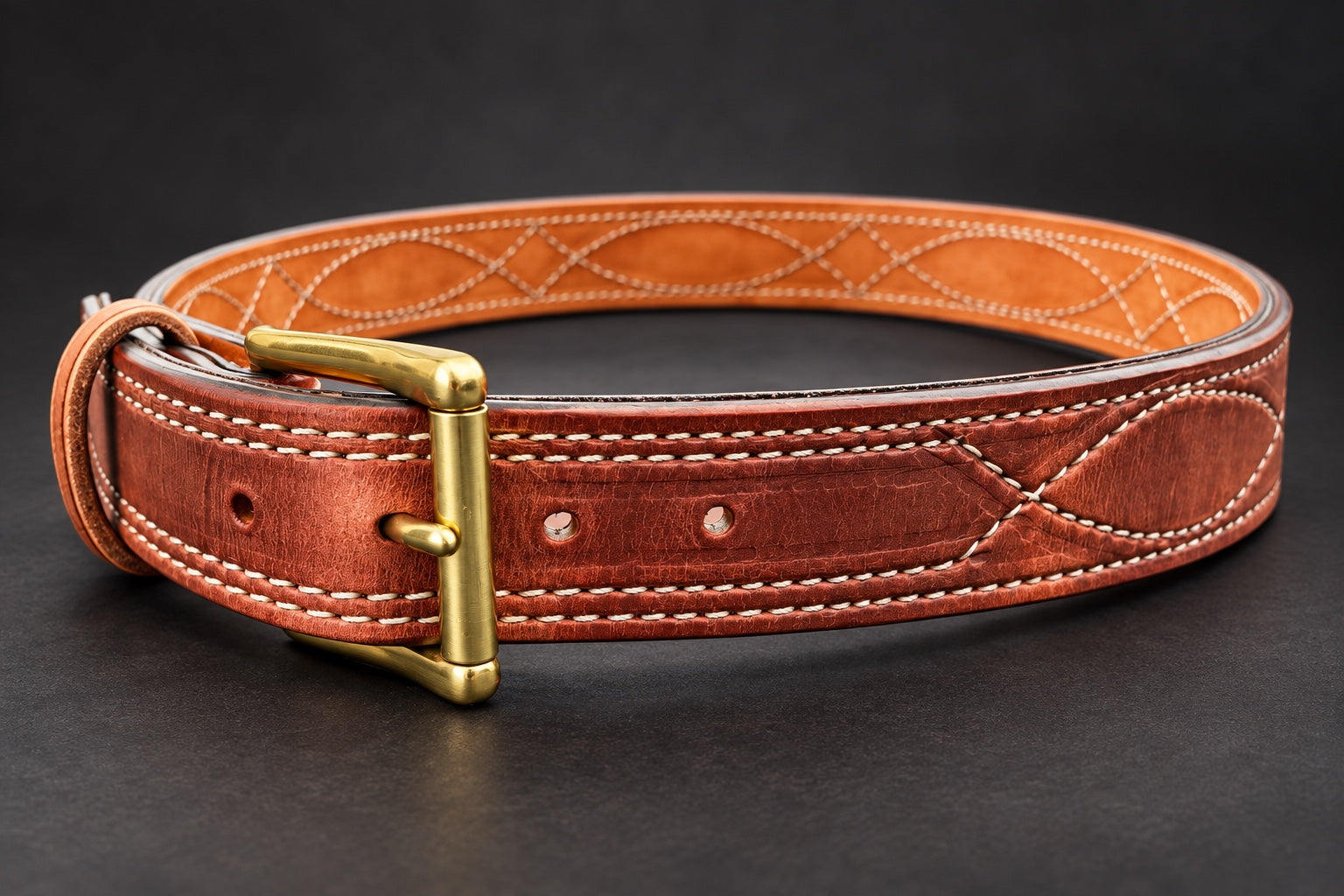 The Young Brand EDC Belt with brass buckle on black studio background