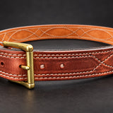 The Young Brand EDC Belt with brass buckle on black studio background