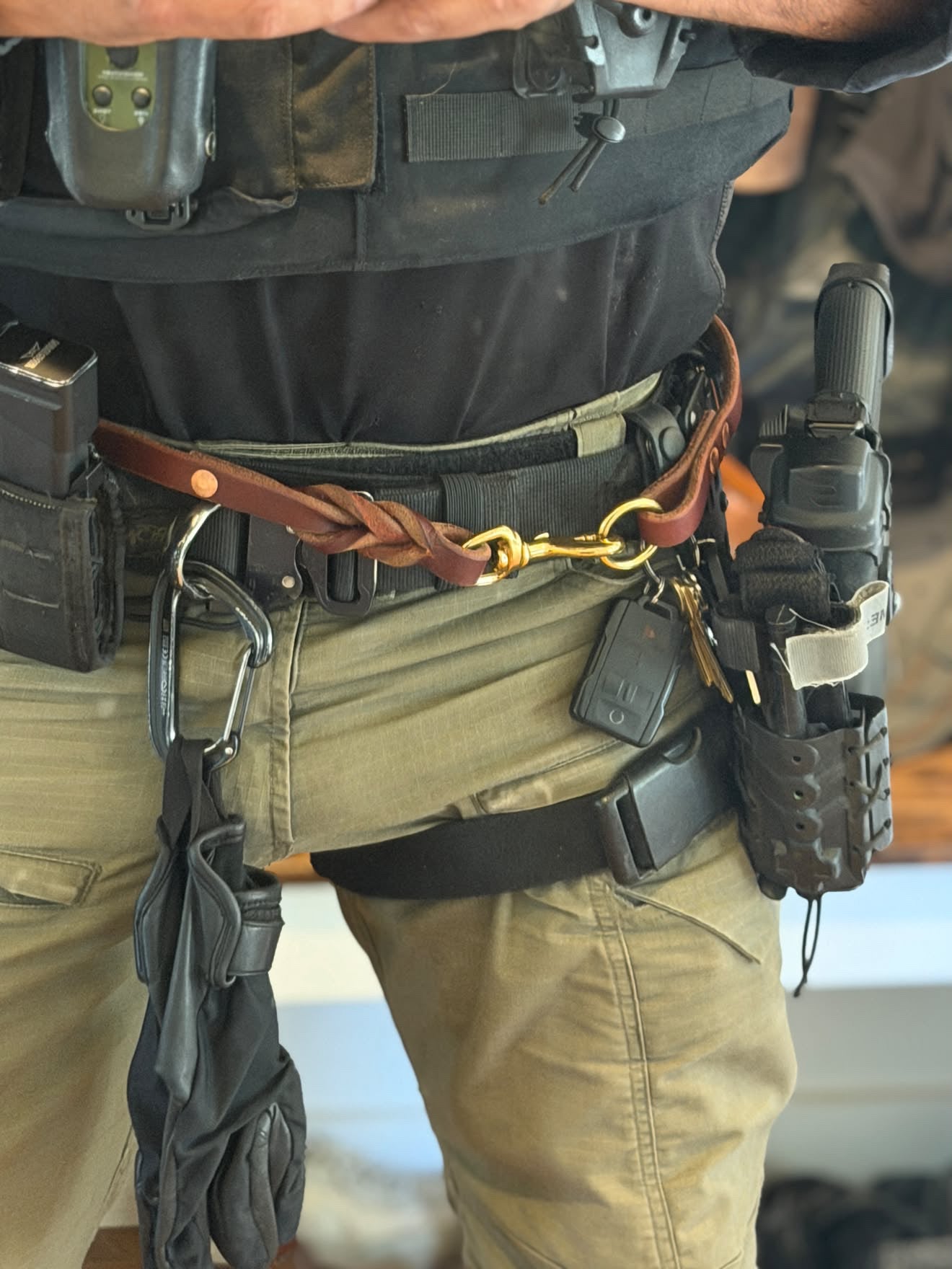 The Braided Working Lead worn by a working K9 handler in field gear